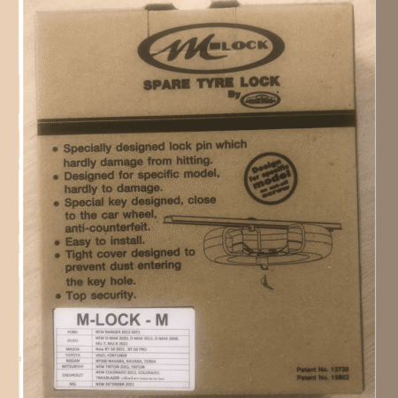 Box for M-Lock spare tyre lock with features list and diagram of lock assembly on the front panel.