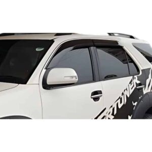 White SUV with a bold black-and-white graphic wrap along the side, partially visible.