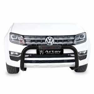 Front view of a white Volkswagen pickup truck with a black bull bar and chrome grille