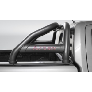 Close-up of a tubular roll bar in a pickup truck bed with a red logo on the bar.