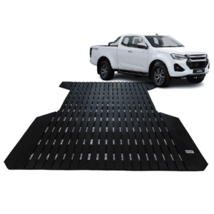 White pickup truck at the end of a long black grated car loading ramp, ready to drive onto a trailer or elevated platform.