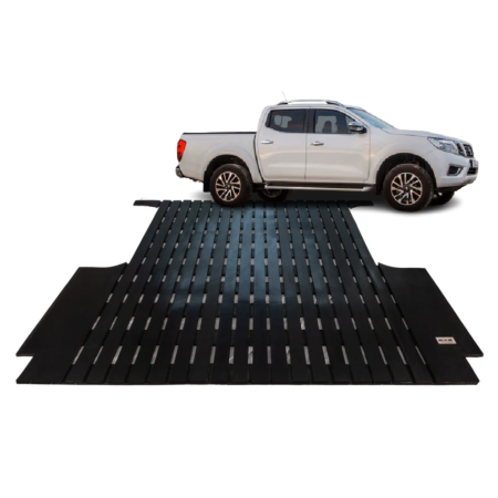 White pickup truck on a black metal vehicle ramp used for loading cars or onto a trailer.