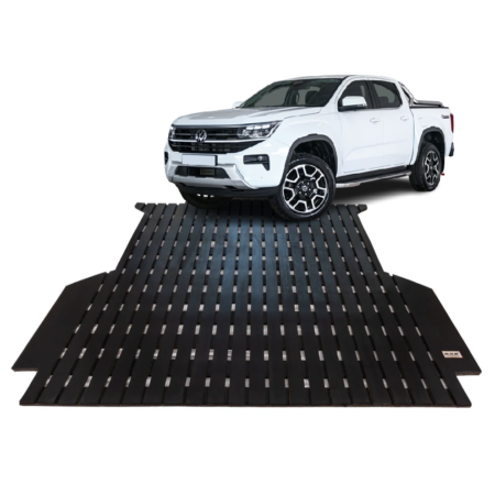 White pickup truck parked on a black grated car ramp/loading platform used for vehicle access